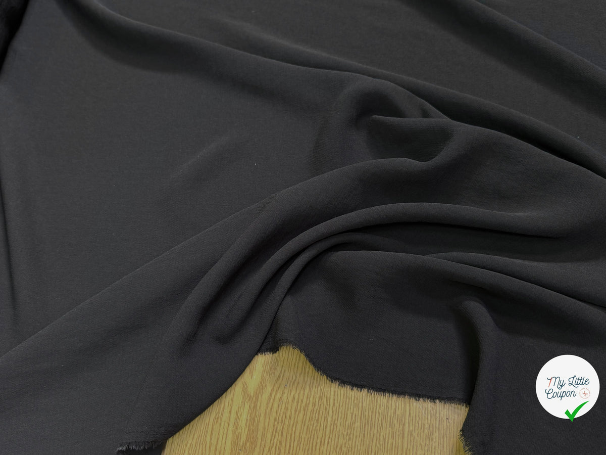Tissu crêpe semi-lourd aspect gaze noir