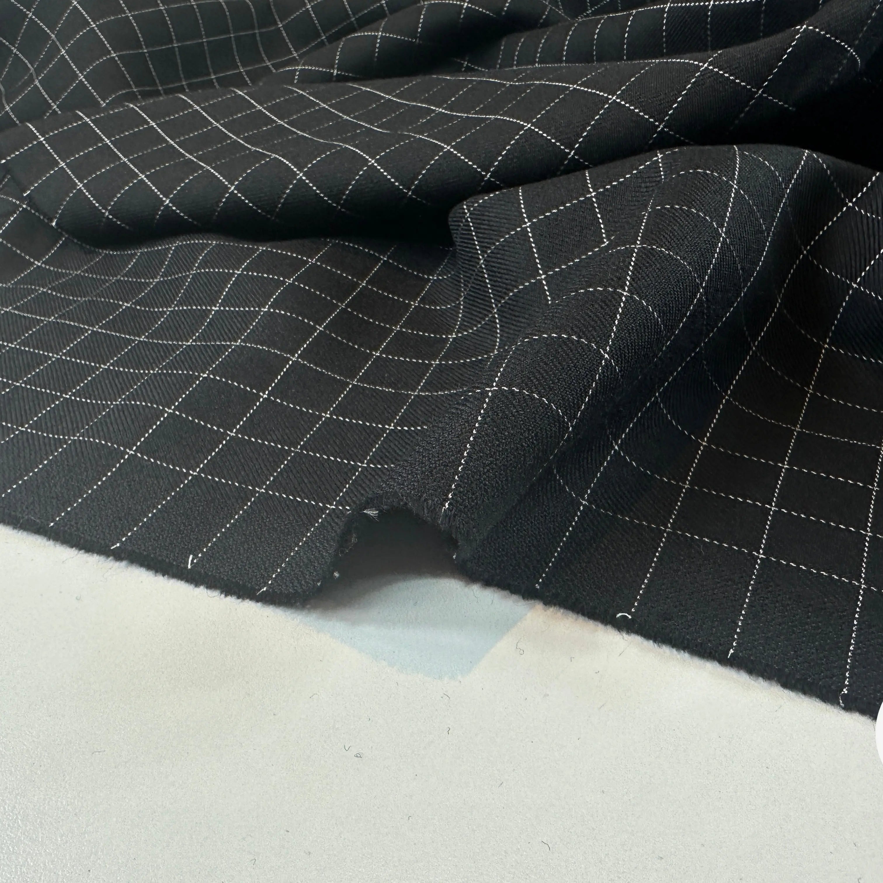 GABARDINE DE LAINE NOIRE QUADRILLÉE BLANCHE MLC INTERN