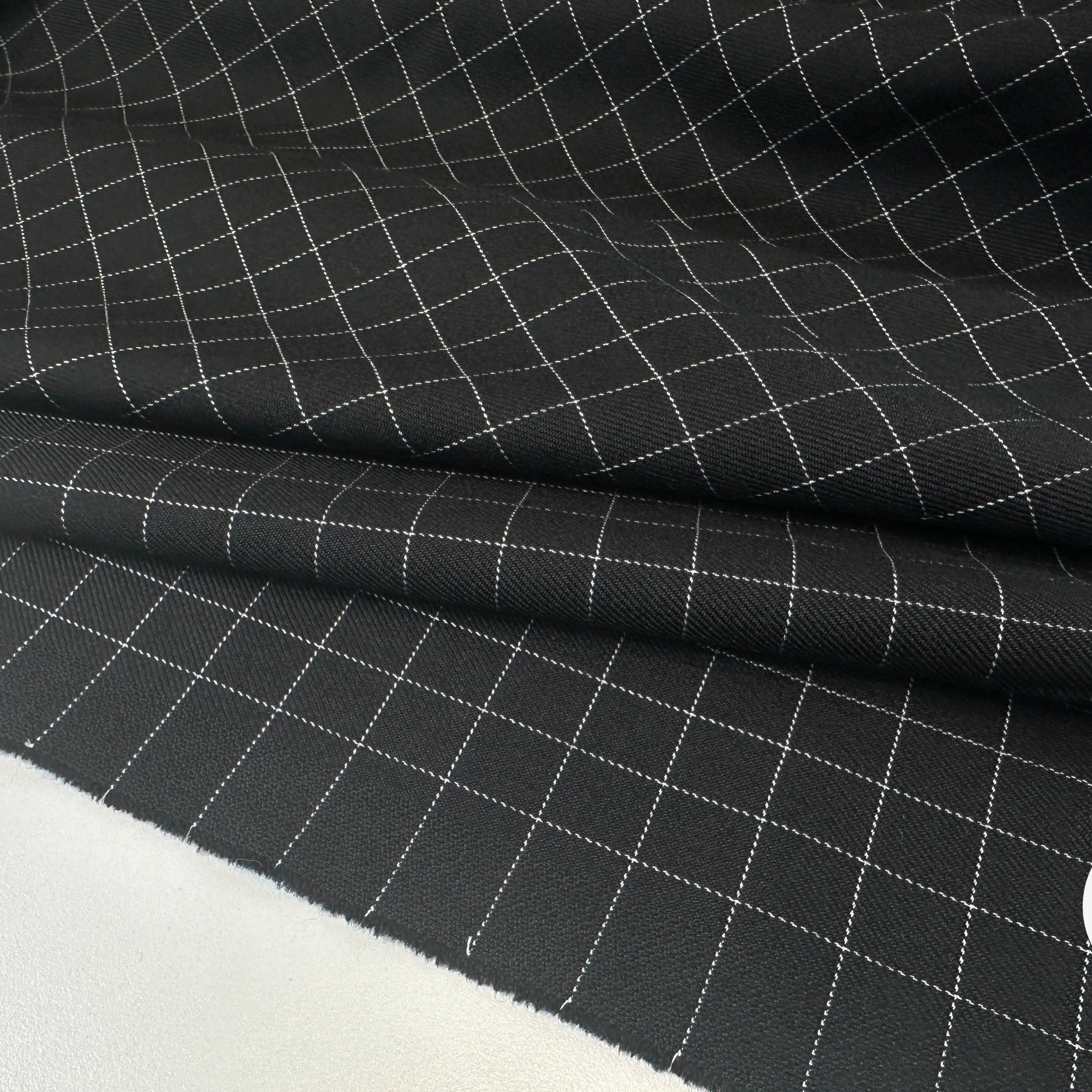 GABARDINE DE LAINE NOIRE QUADRILLÉE BLANCHE MLC INTERN