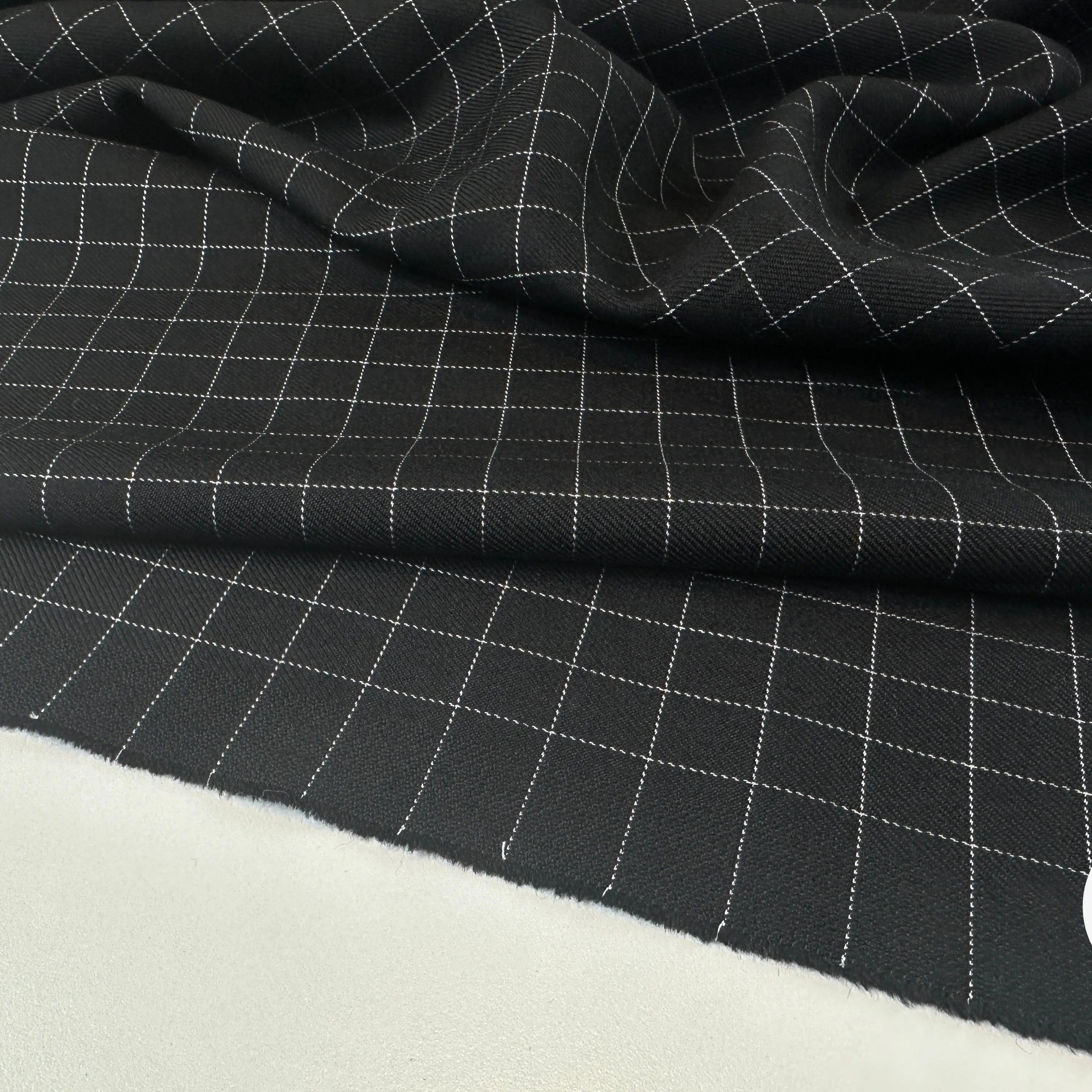 GABARDINE DE LAINE NOIRE QUADRILLÉE BLANCHE MLC INTERN