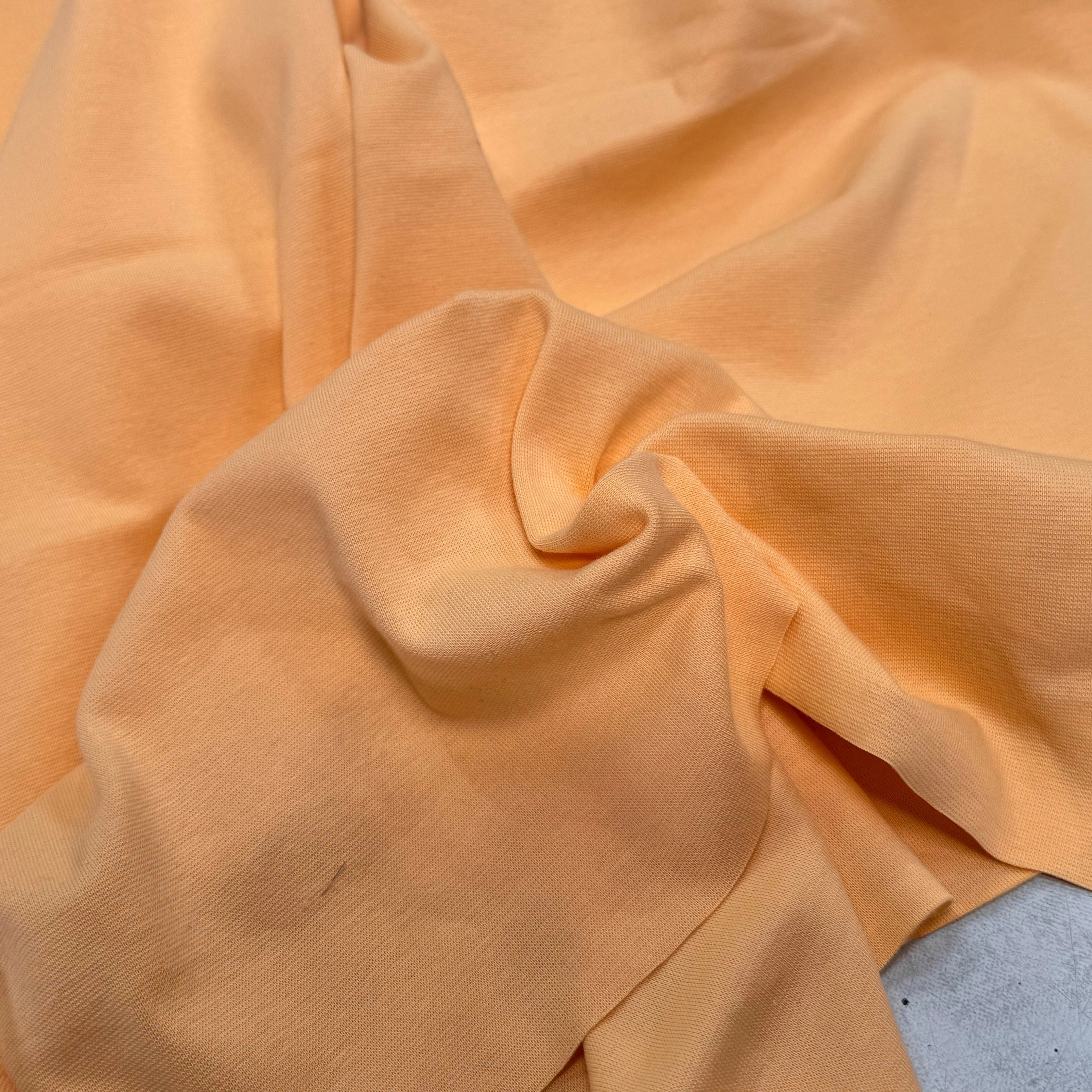 JERSEY COTON 2% ÉLASTHANNE TUBULAIRE 70CM CÔTE 1X1 BUFF ORANGE - My Little Coupon