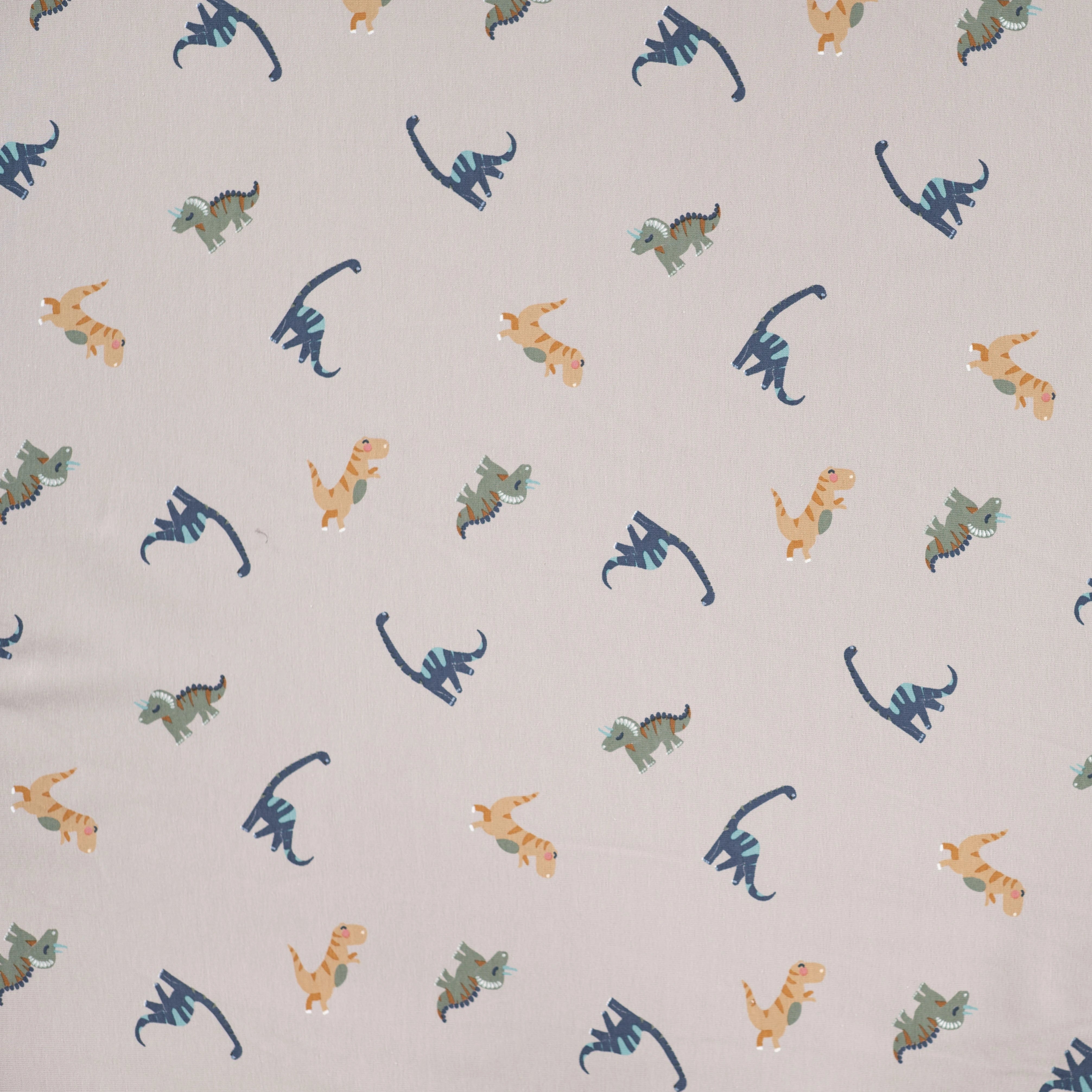 JERSEY DE COTON IMPRIMÉ DINOSAURES FOND SABLE - My Little Coupon