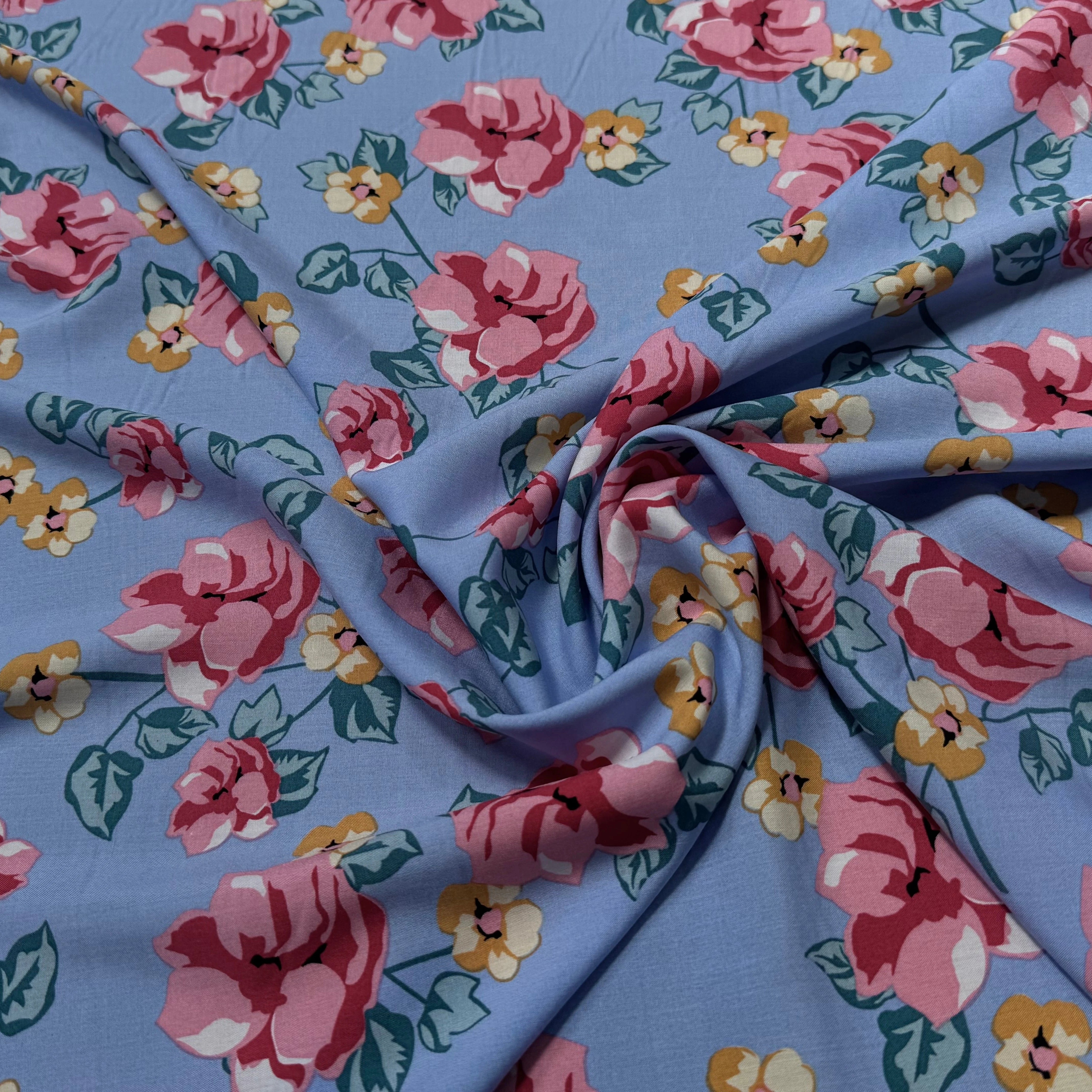 TISSU 100% VISCOSE IMPRIMÉ BRANCHES À FLEURS FOND BLEU CIEL - My Little Coupon