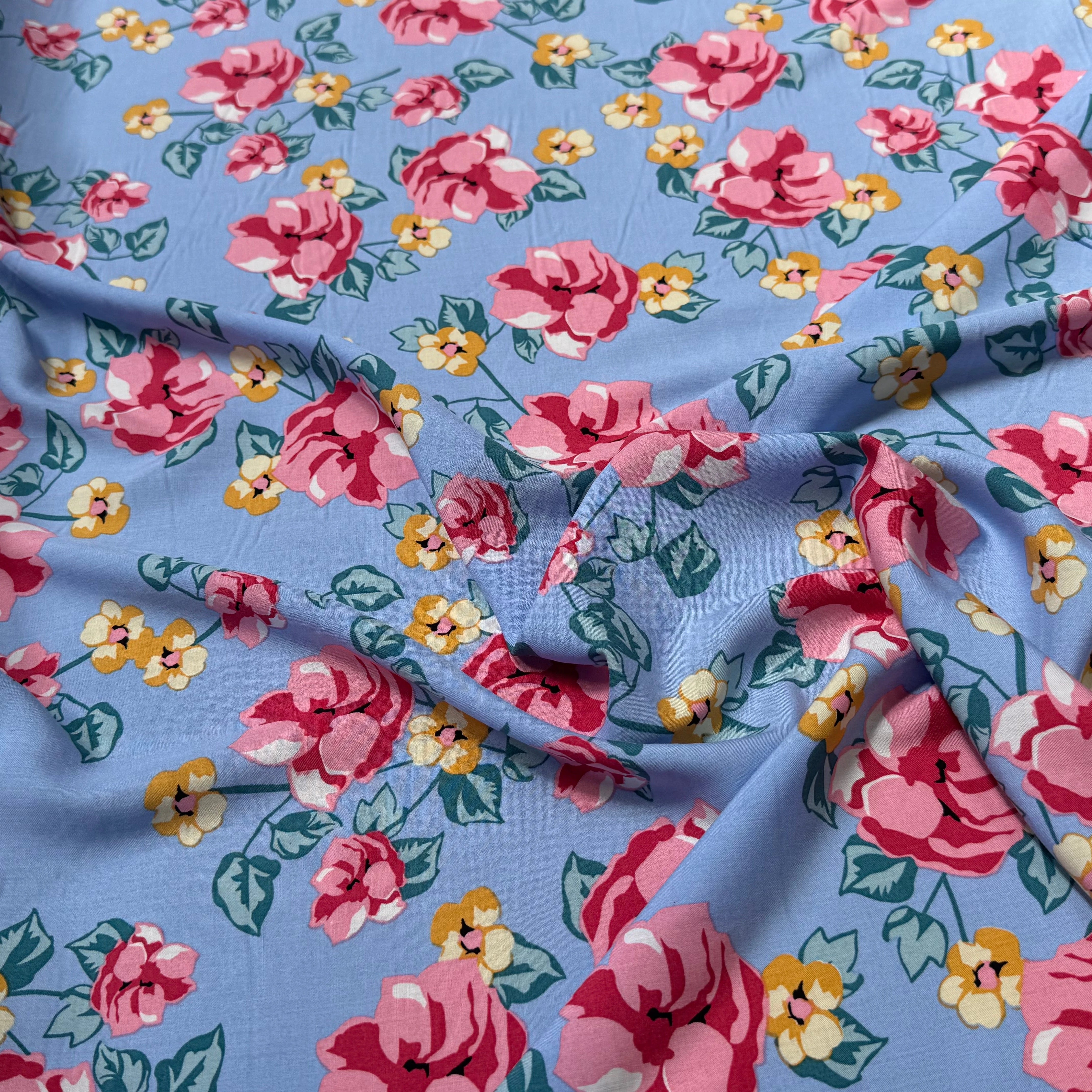 TISSU 100% VISCOSE IMPRIMÉ BRANCHES À FLEURS FOND BLEU CIEL - My Little Coupon