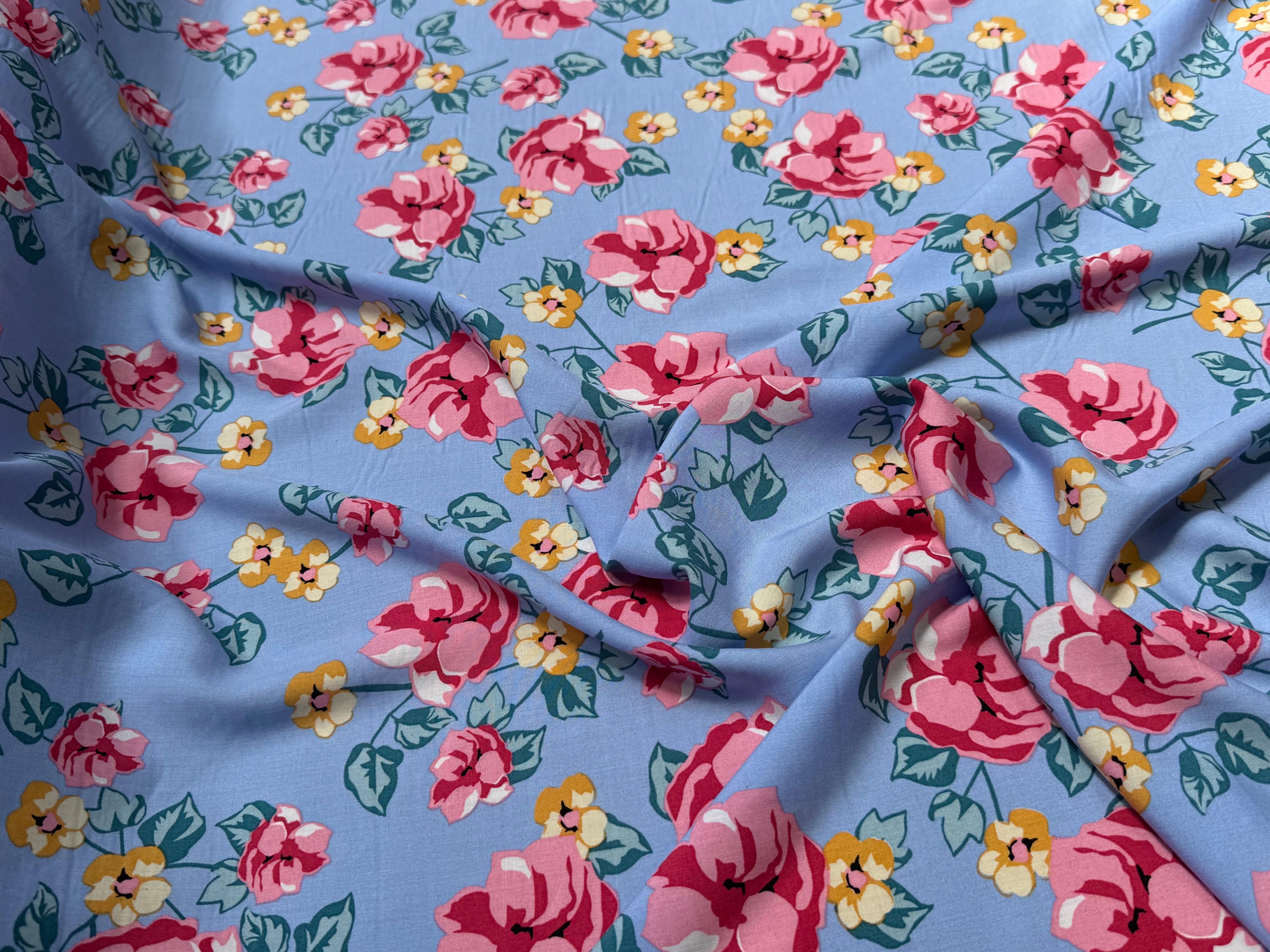 TISSU 100% VISCOSE IMPRIMÉ BRANCHES À FLEURS FOND BLEU CIEL - My Little Coupon