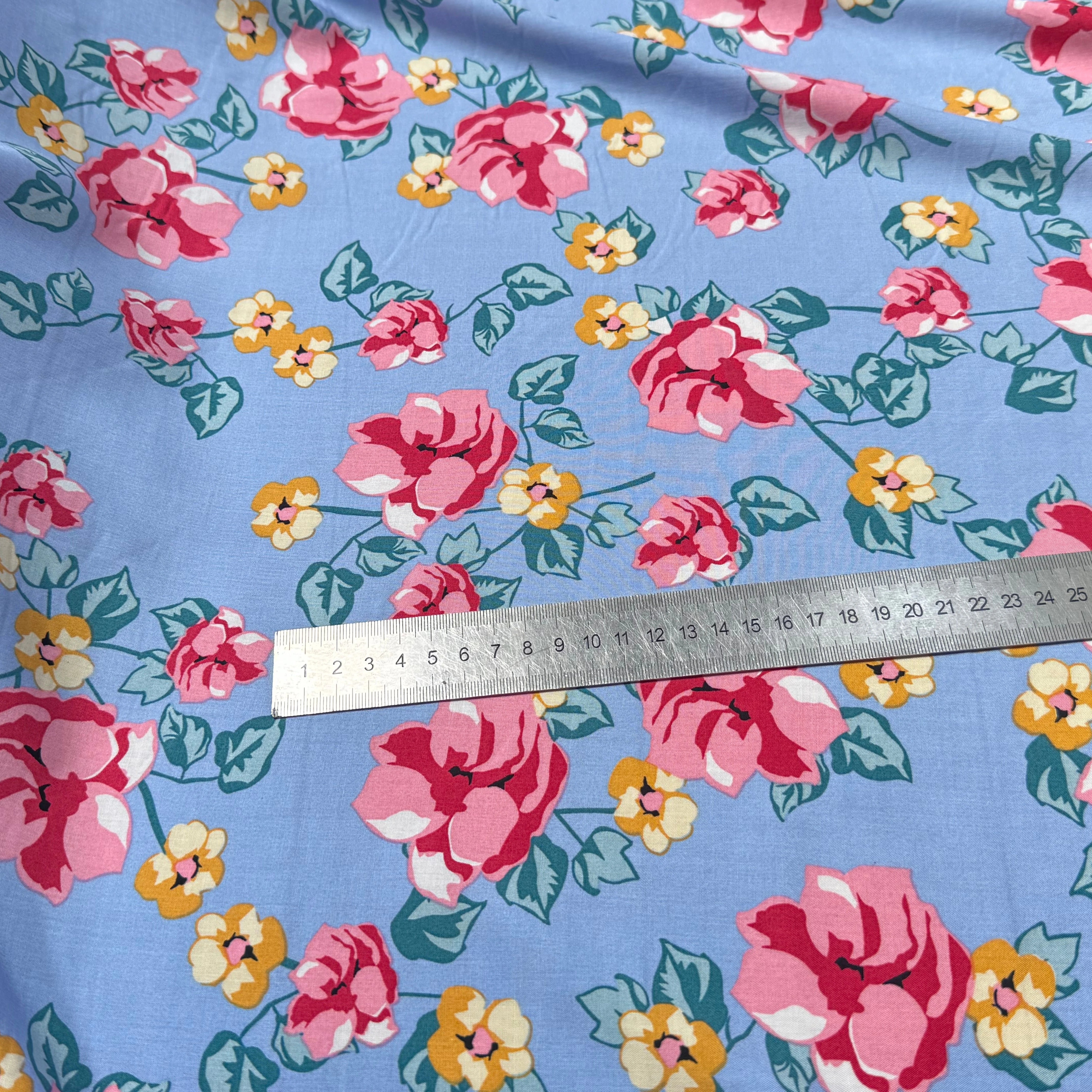 TISSU 100% VISCOSE IMPRIMÉ BRANCHES À FLEURS FOND BLEU CIEL - My Little Coupon