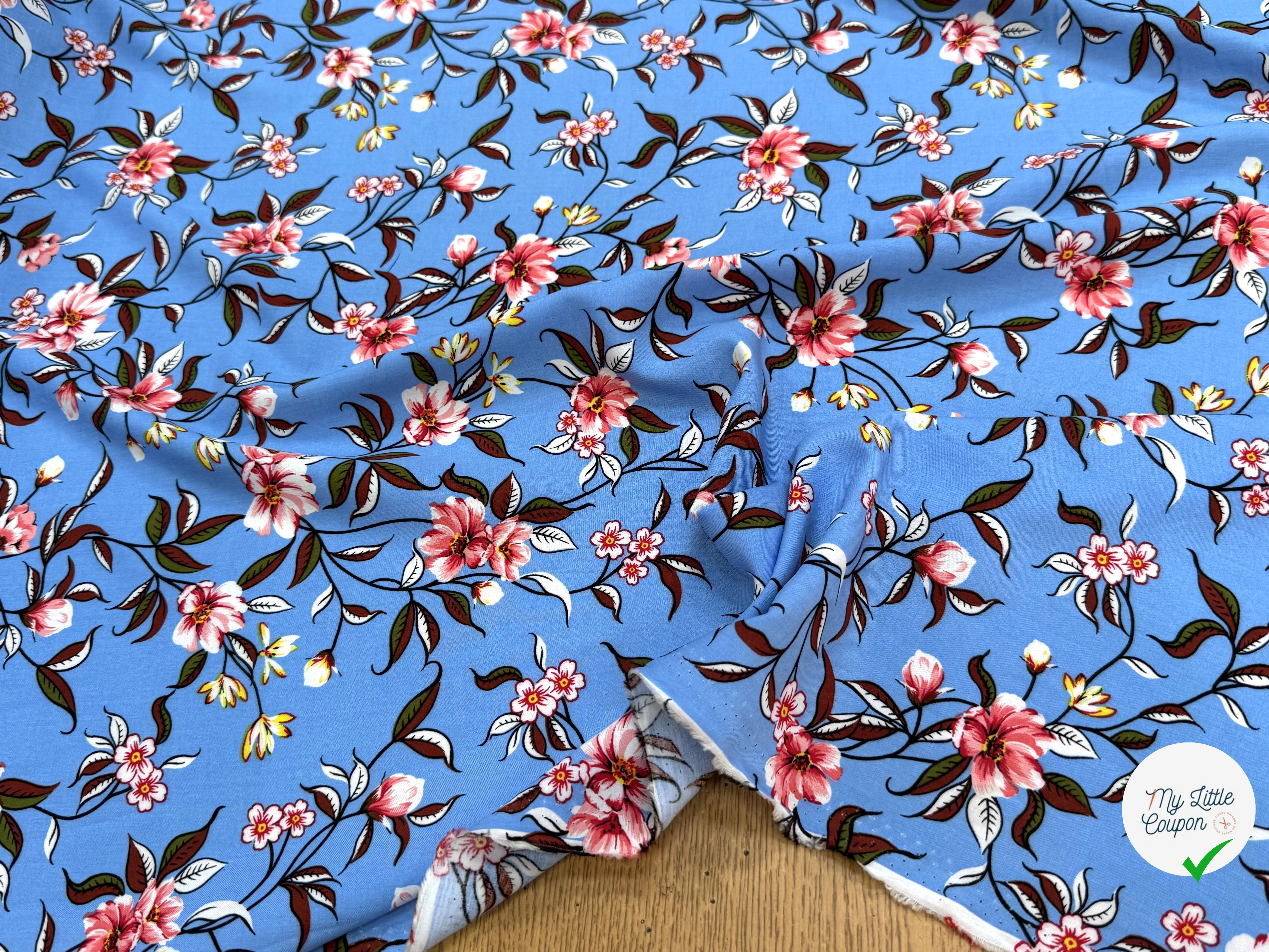 TISSU 100% VISCOSE IMPRIMÉ FOND BLEU CIEL - My Little Coupon