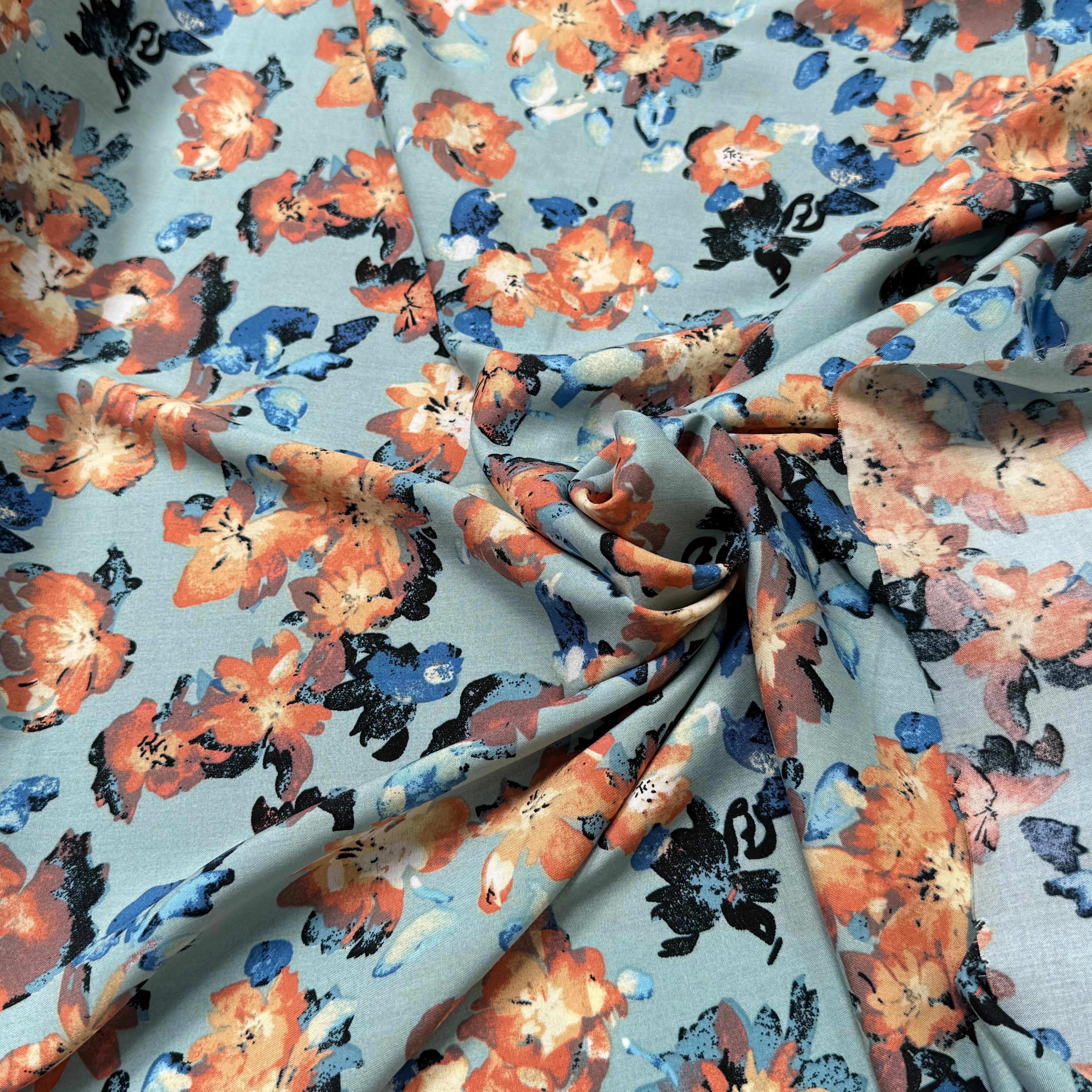 TISSU 100% VISCOSE IMPRIMÉ GROSSES BASES DE FLEURS FOND VERT D'EAU - My Little Coupon