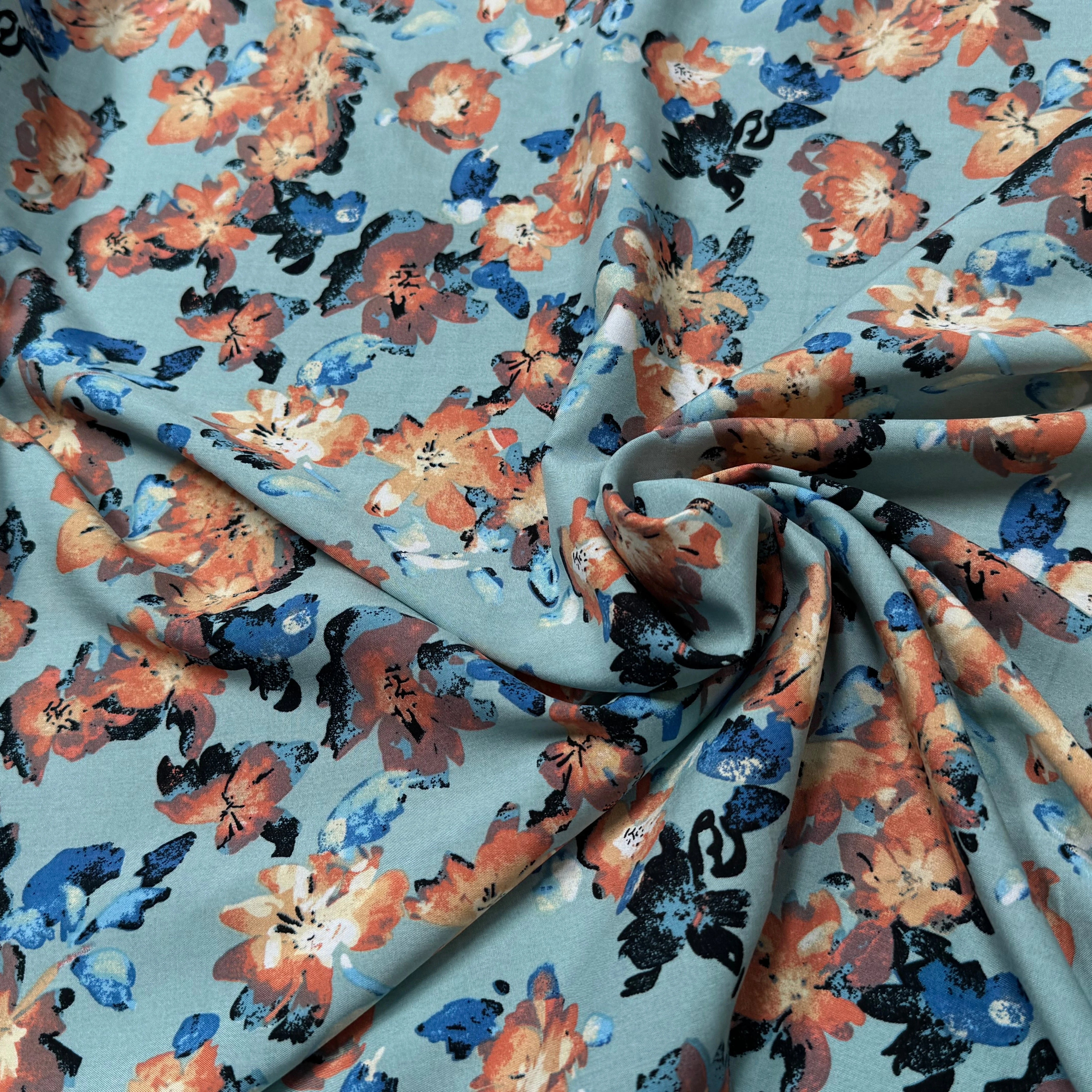 TISSU 100% VISCOSE IMPRIMÉ GROSSES BASES DE FLEURS FOND VERT D'EAU - My Little Coupon