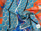 CRÊPE DE VISCOSE FLUIDE IMPRIMÉ TYPOGRAPHIQUE BLEU ET ORANGE FANTASY TYPO ORANGE - My Little Coupon