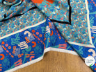 CRÊPE DE VISCOSE FLUIDE IMPRIMÉ TYPOGRAPHIQUE BLEU ET ORANGE FANTASY TYPO ORANGE - My Little Coupon