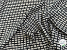 CRÊPE DE VISCOSE IMPRIMÉ SEMIS DE FLEURS FOND NOIR - My Little Coupon