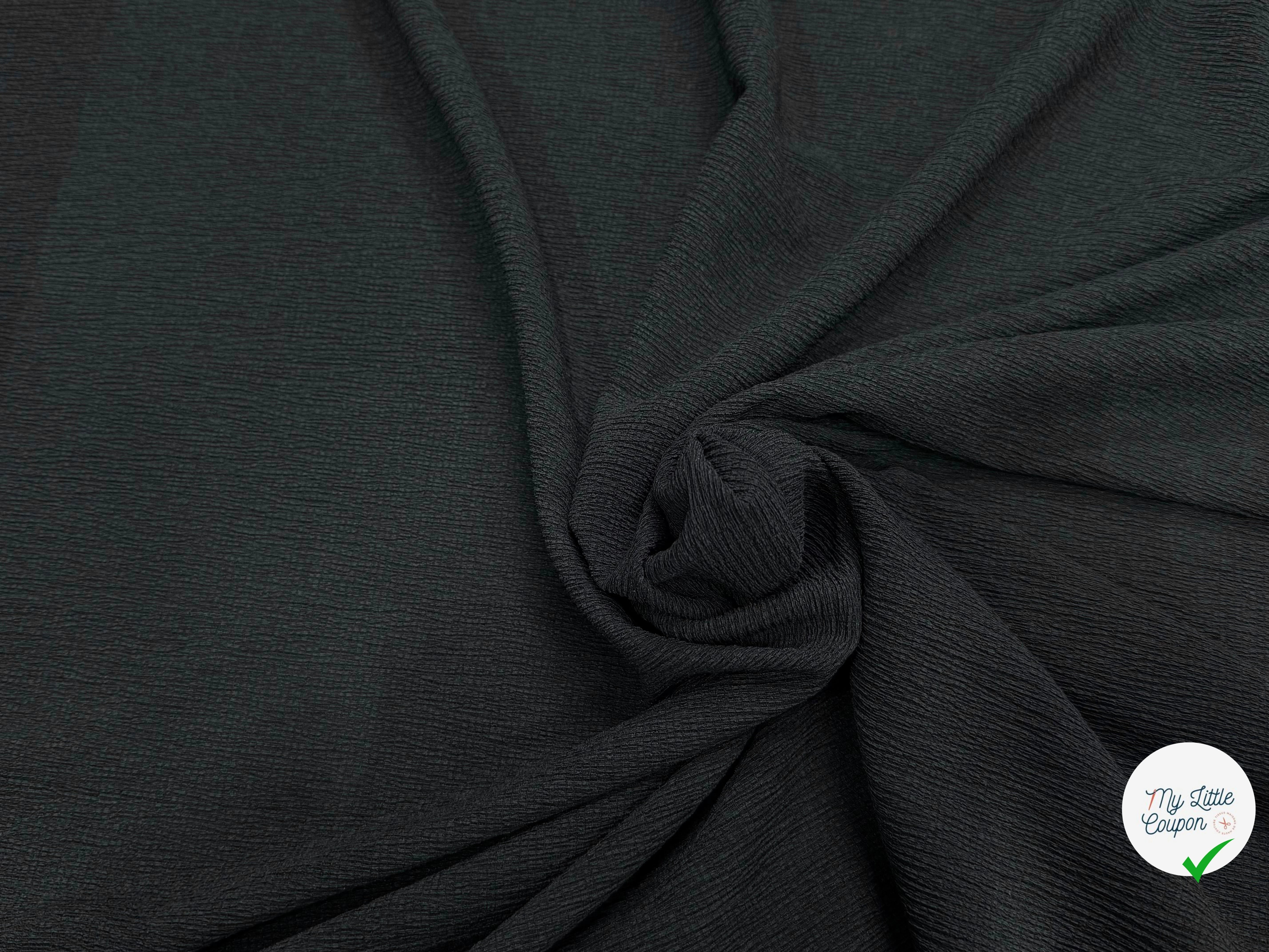 Tissu crêpe gaufré noir légèrement stretch au tombé plombant, effet double gaze