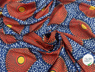 CRÊPE LÉGÈREMENT SATINÉ ROSACES ABYSALES ORANGE ET BLEU MLC INTERN