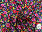 VISCOSE TOUCHÉ PEAU DE PÊCHE IMPRIMÉ FLEURS SUR FOND NOIR - My Little Coupon