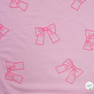 JERSEY COTON 5% ELASTHANNE MOTIFS NOEUDS ROSES FOND ROSE - My Little Coupon