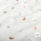 Jersey de coton papillons blanc cassé