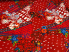 JERSEY VISCOSE EXPLOSION DE FLEURS FOND ROUGE - My Little Coupon