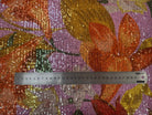 SEQUIN FOND ROSE MOTIFS FLEURS JAUNE ORANGE ET VERT - My Little Coupon