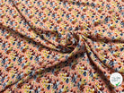 TISSU 100% VISCOSE FOND ORANGE PÊCHE IMPRIMÉ BOUQUETS - My Little Coupon