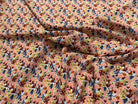 TISSU 100% VISCOSE FOND ORANGE PÊCHE IMPRIMÉ BOUQUETS - My Little Coupon