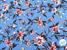 TISSU 100% VISCOSE IMPRIMÉ FOND BLEU CIEL - My Little Coupon
