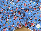 TISSU 100% VISCOSE IMPRIMÉ FOND BLEU CIEL - My Little Coupon