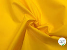 TISSU ANORAK JAUNE MATE ENDUIT - My Little Coupon - tissu - coudre