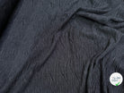 Tissu fluide cloqué stretch noir - détail du tissu