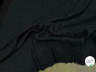 Tissu fluide cloqué stretch noir - tombé du tissu