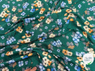VISCOSE À FLEURS JAPONAISES BLEUES ET BEIGES SUR FOND VERT - My Little Coupon