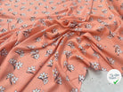 VISCOSE À MOTIF D'HIBISCUS À FOND PÊCHE - My Little Coupon