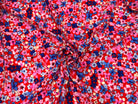 VISCOSE D'UNE MULTITUDE DE FLEURS FOND ROUGE MLC INTERN