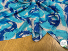VISCOSE FLUIDE FOND BLANC IMPRIMÉE TOURBILLON ROI TURQUOISE - My Little Coupon